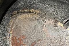 Rusty iron plate with code number